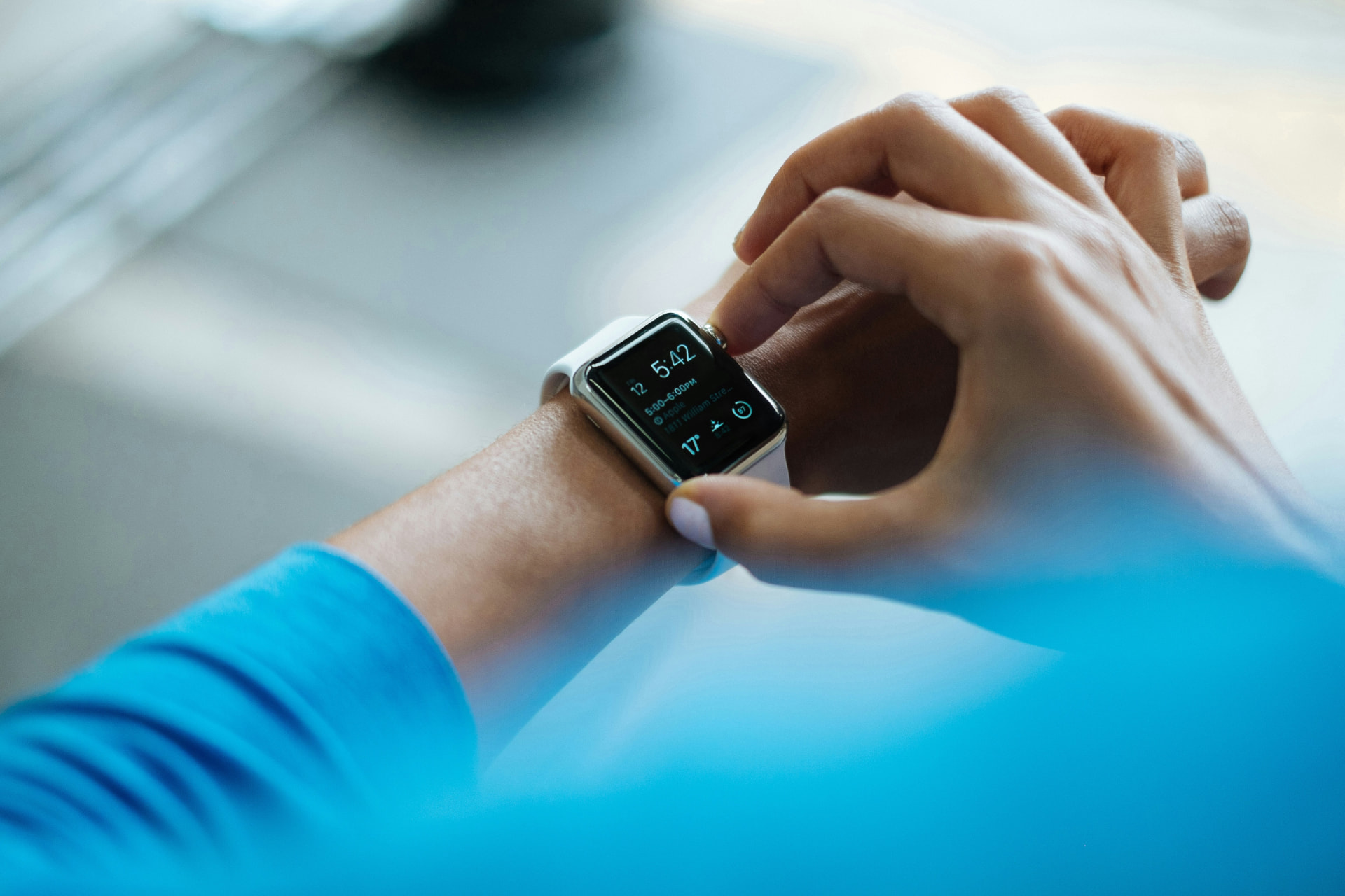 A person checking health data on a smartwatch